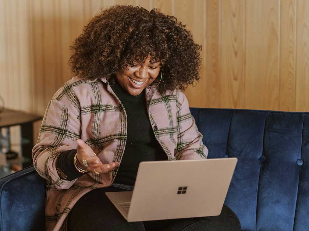 A woman looking at a laptop