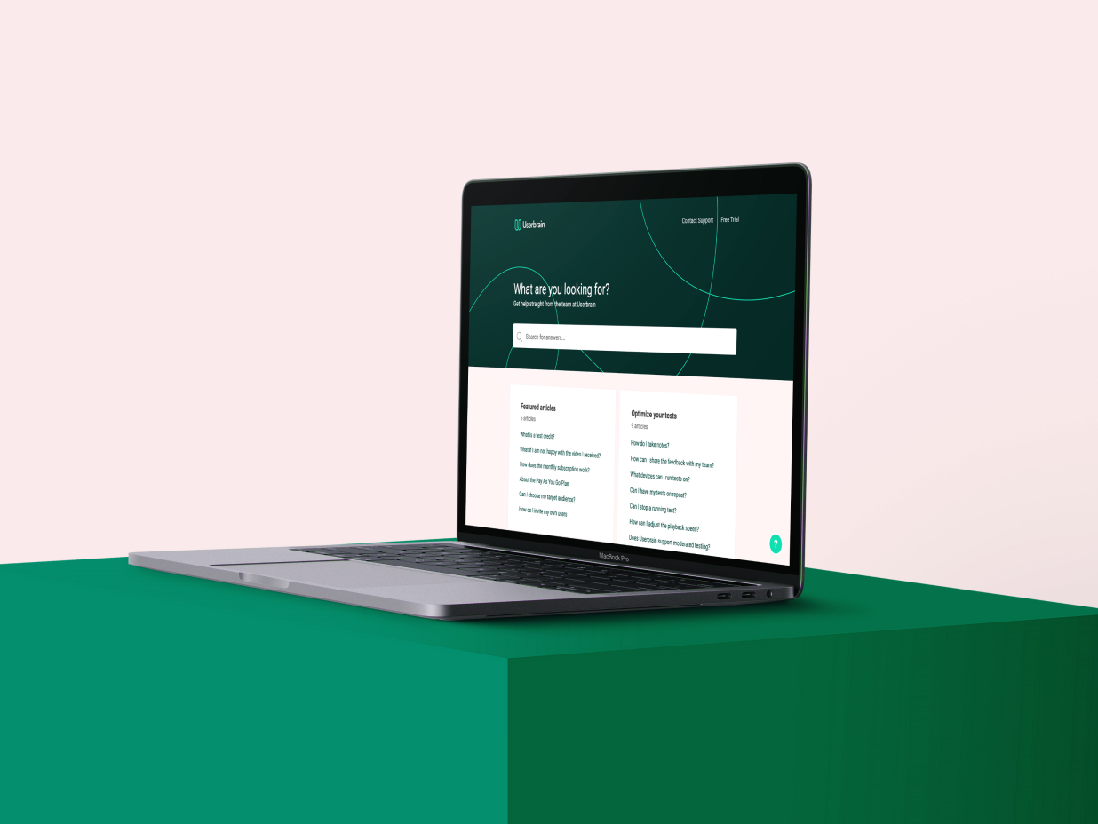Macbook Pro with knowledge base article about user testing Figma prototypes with Userbrain opened